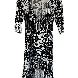 Lasania Black and White print dress with wrap V neck collar.